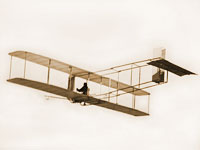 Wright brothers' glider in flight at Kitty Hawk