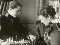 Photo, Helen and Anne playing chess, 1900, American Foundation for the Blind