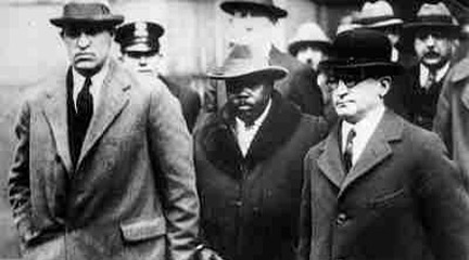 Photograph, Garvey in custody of U.S. marshals en route..., 1925, UCLA.