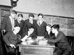 Image, boys around a desk