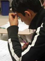 A student completing an in-class assignment. NHEC