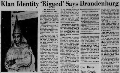 newspaper article with photograph of Brandenburg in his KKK robes. Title: "Klan Identity 'Rigged' Says Brandenburg