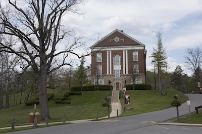 Side view of David & Elkins College showing the stairs that lead up to the building.