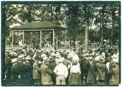 Large crowd gathers around a gazebo to listen to Eugene Debs