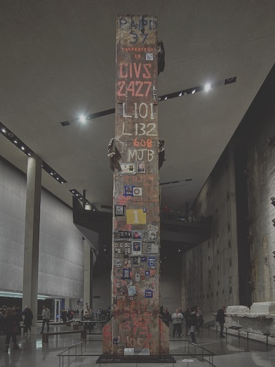 Tall column spanning the height of the building. The column contains written text and photographs from the top to the bottom