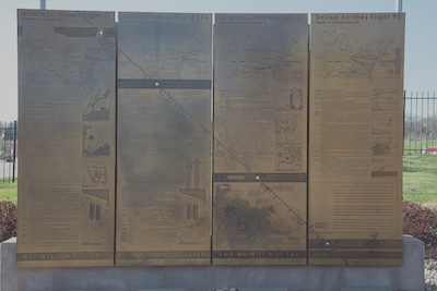 Four informational panels commemorating the passengers on each of the flights during 9/11. The stories are engraved on tall metallic sheets.