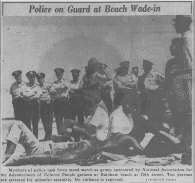 “Chicago Tribune, July 9, 1961. Police on Guard at Beach Wade-In police stand and look down on group of young African Americans sitting on the beach.