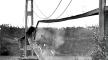 Photograph, Bridge midsection crashing into the waters of the Tacoma Narrows, November 7, 1940, Bashford and Thompson Photo, University of Washington Libraries, Special Collections. Photo, Bridge midsection crashing into, Nov. 7 1940, Bashford & Thompson, UW, SC