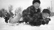 Photo, Two boys sledding, Minidoka Relocation Camp, January 9, 1943, Francis Stewart, UW Digital Collections, Flickr Commons Photo, Two boys sledding, Minidoka. . . , 1943, Francis Stewart, Flickr Commons