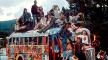 The "Road Hog" bus, El Rito, New Mexico, Fourth of July parade, 1968. Buses, decorated in psychedelic colors, provided a home on the road as groups staged protests and created happenings. Photo. The "Road Hog" bus, El Rito, New Mexico. 1968. Lisa Law