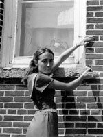 Photo, Alex Parins farm, Woman displaying lay of the bricks, 1976