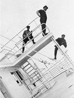 Photo, Crew standing on the shipwrecked George M. Cox, May 1933